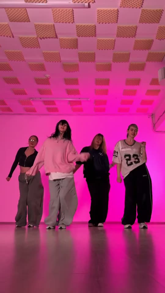 Four people dancing in studio