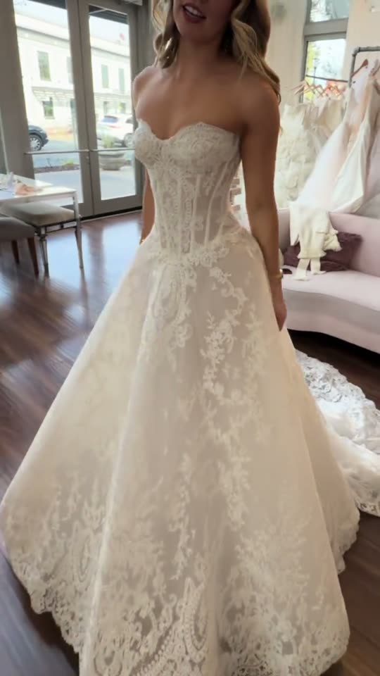 Woman tries on a wedding dress
