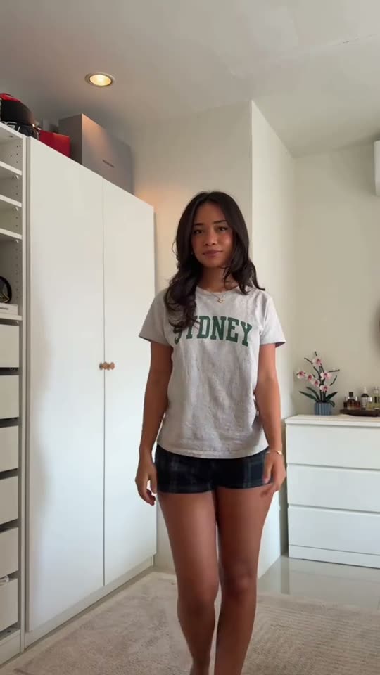 Woman showing casual outfit before change