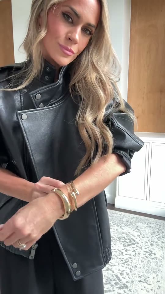 Woman tries on leather jacket