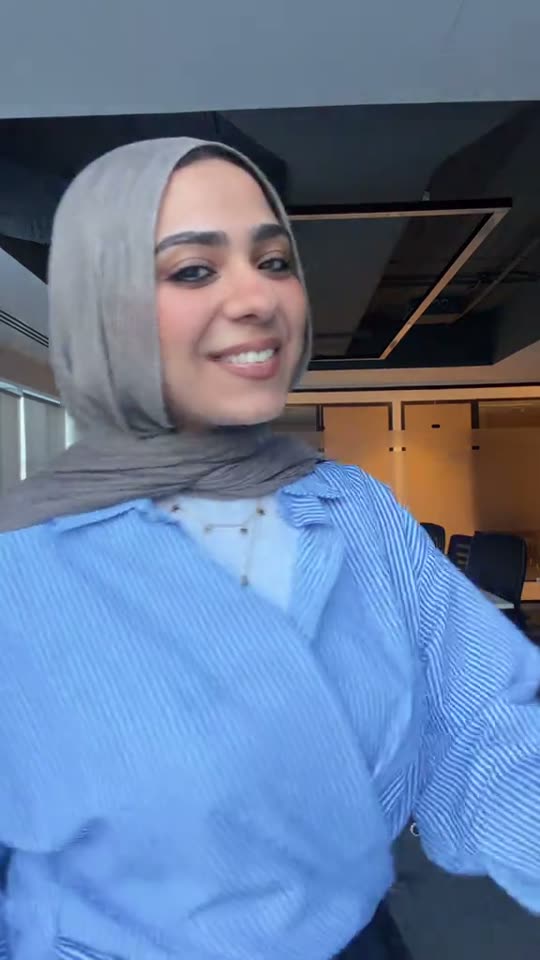 Woman poses in office outfit