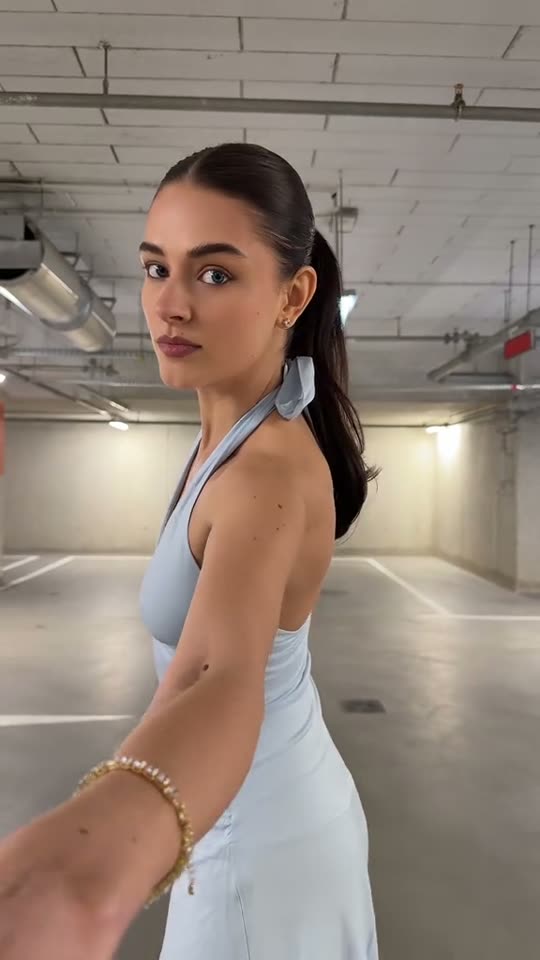 Woman in blue dress walks