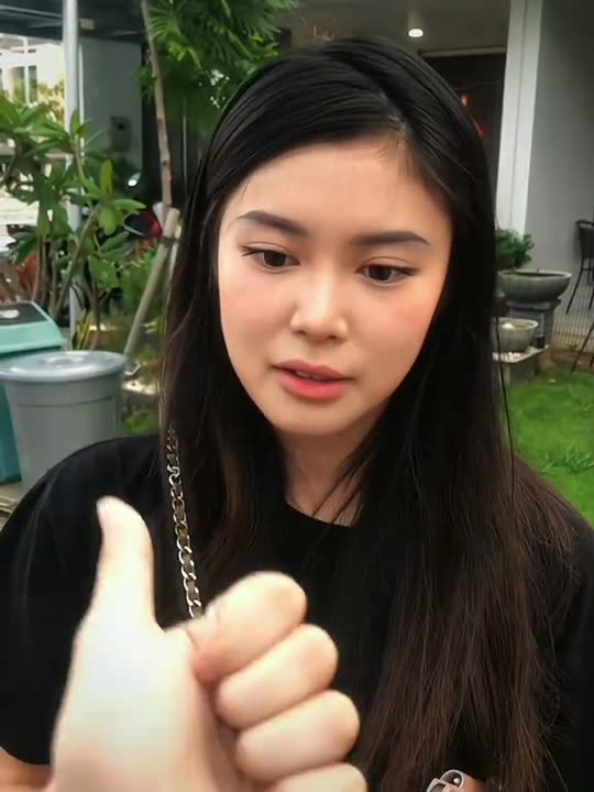 Girl looking at her hand