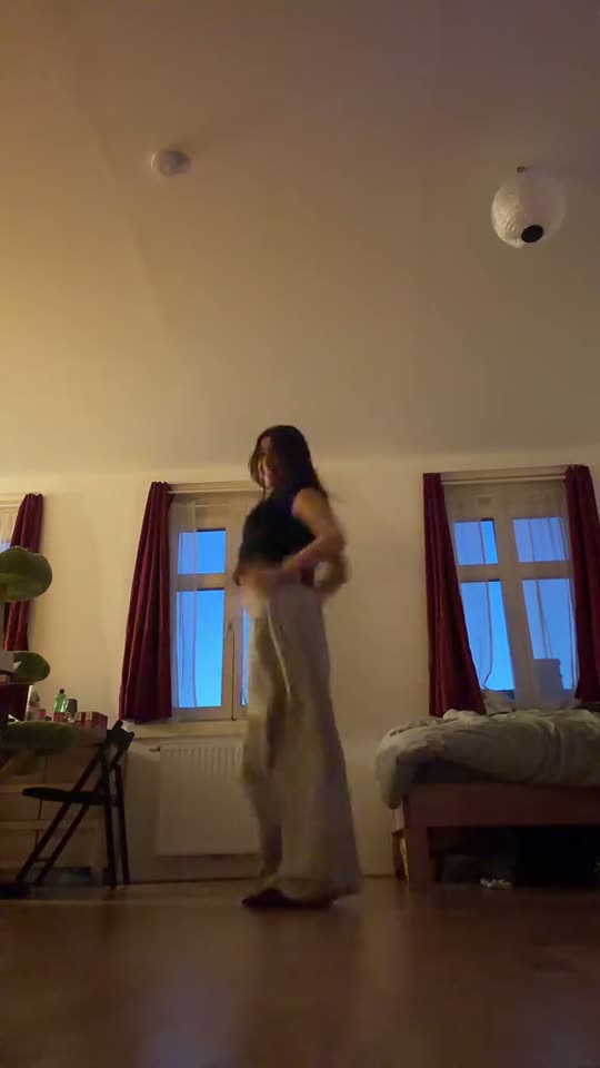 Woman dancing in her room
