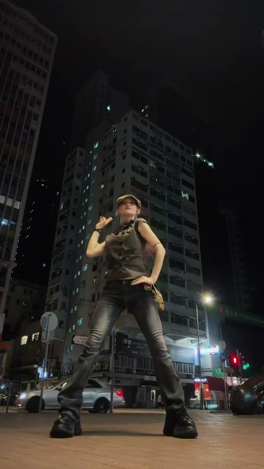 Dancing in city at night