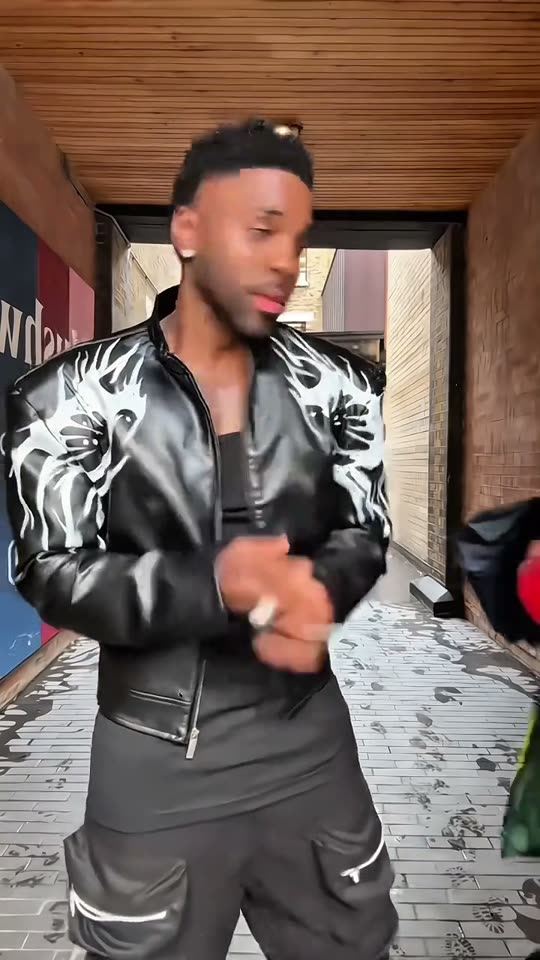 Man dancing in alleyway
