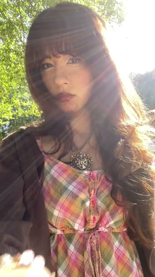 Woman shows off plaid dress