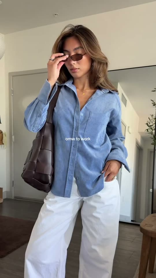 Woman shows office outfit