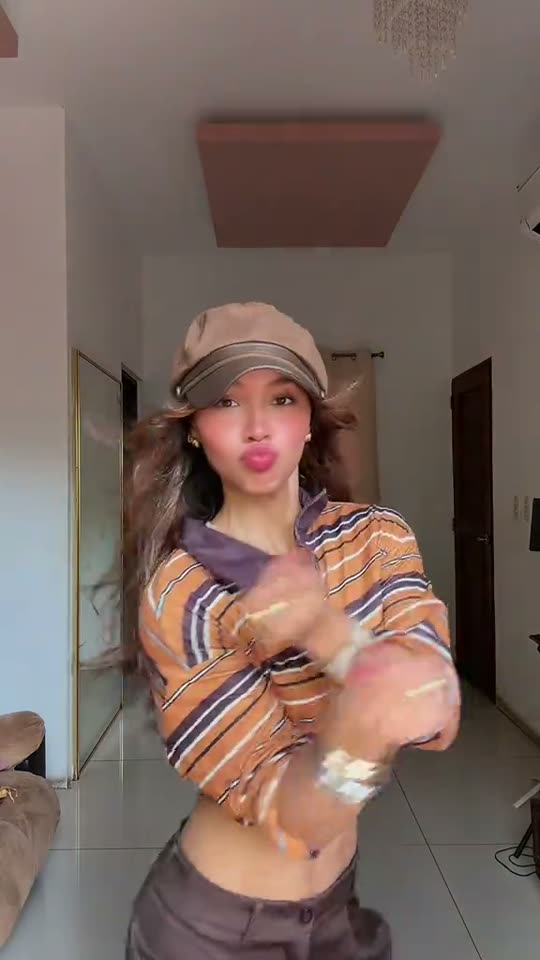 Woman dancing in a hallway