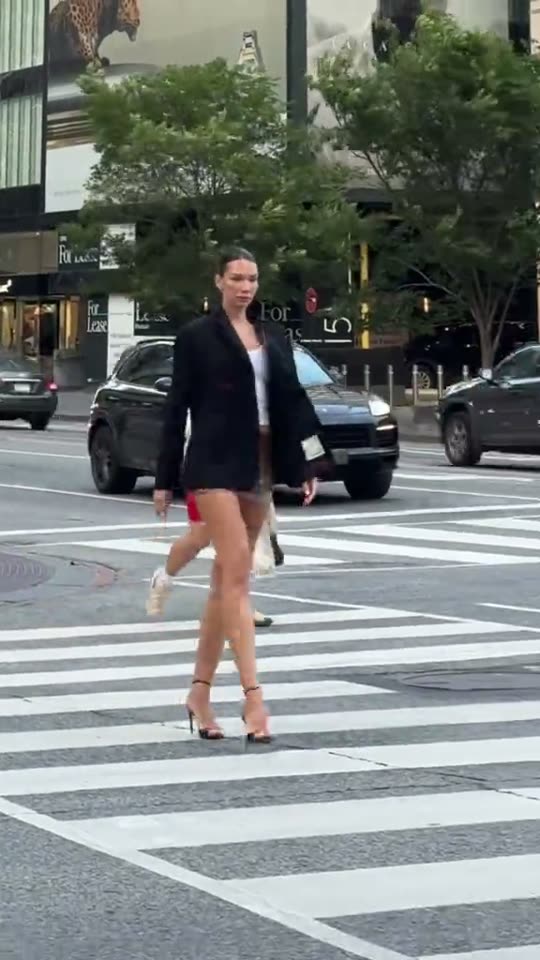 Woman crosses street in heels