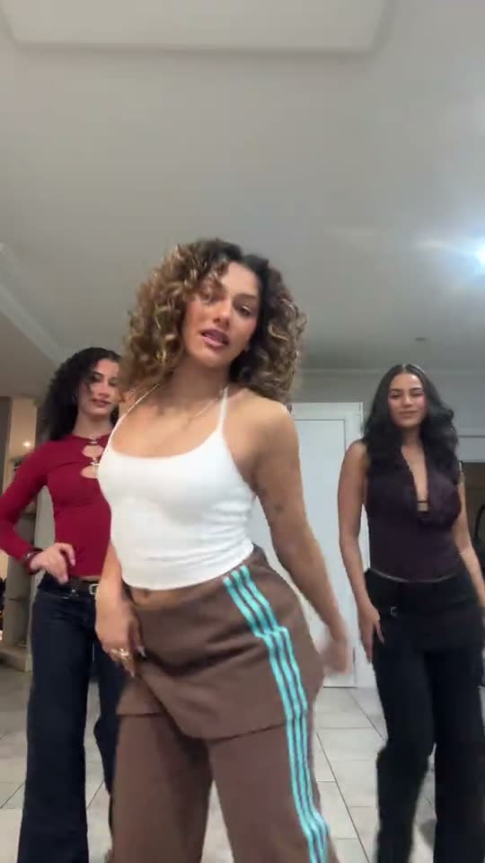 Three women doing a dance