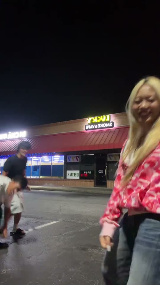 Friends dancing in parking lot