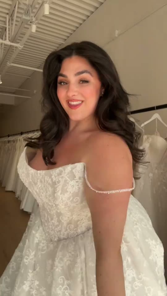 Woman tries on a wedding dress