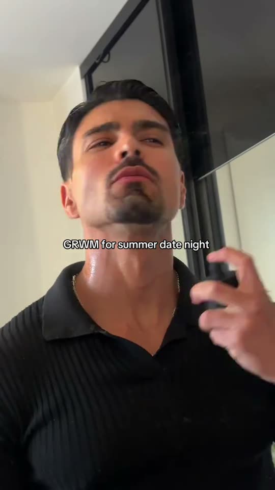 Man sprays perfume for date