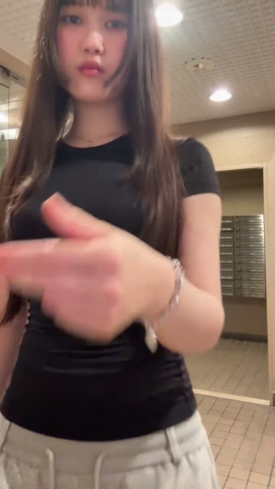 Outfit transition in a hallway