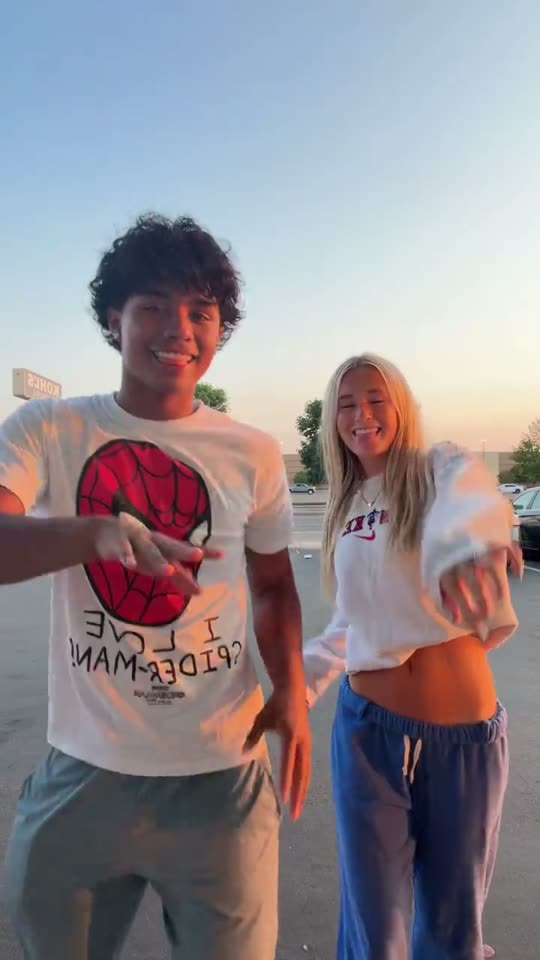 Two people dancing outdoors