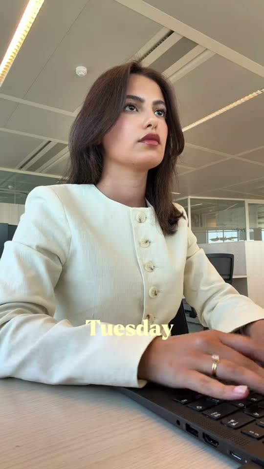 Woman typing at office desk