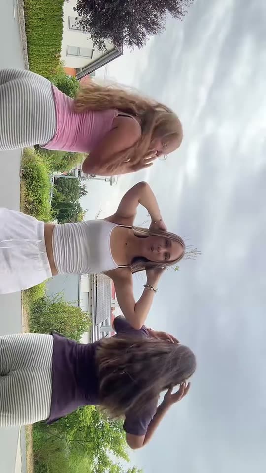 Three girls dancing outdoors