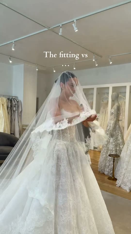 Bride tries on wedding dress