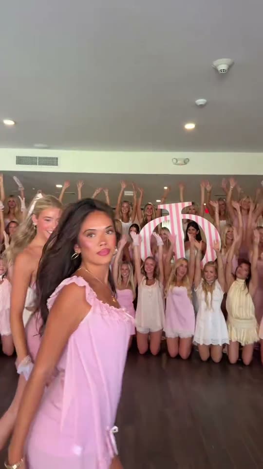 Woman dances with group