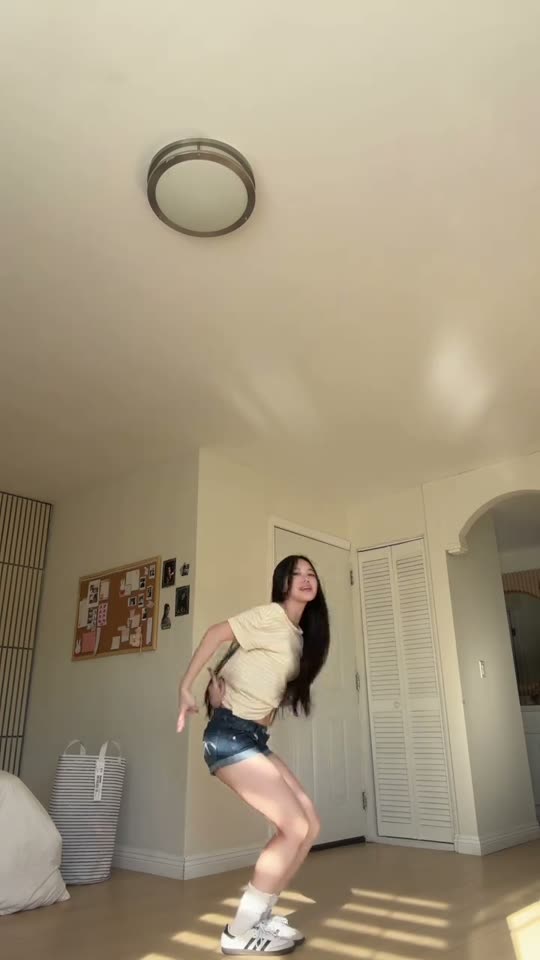 Girl dances in bedroom