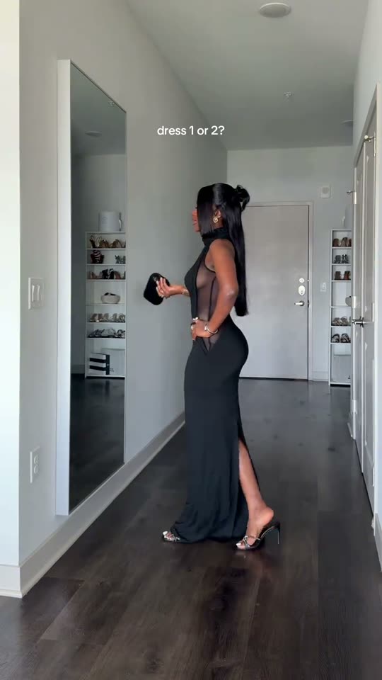 Woman models a black dress
