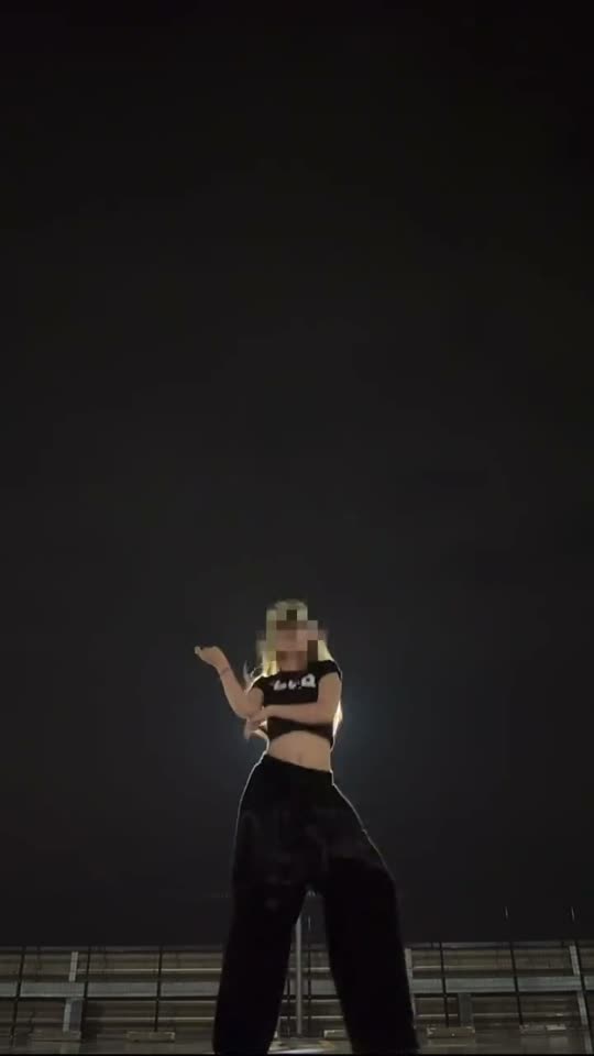 Woman dancing at night