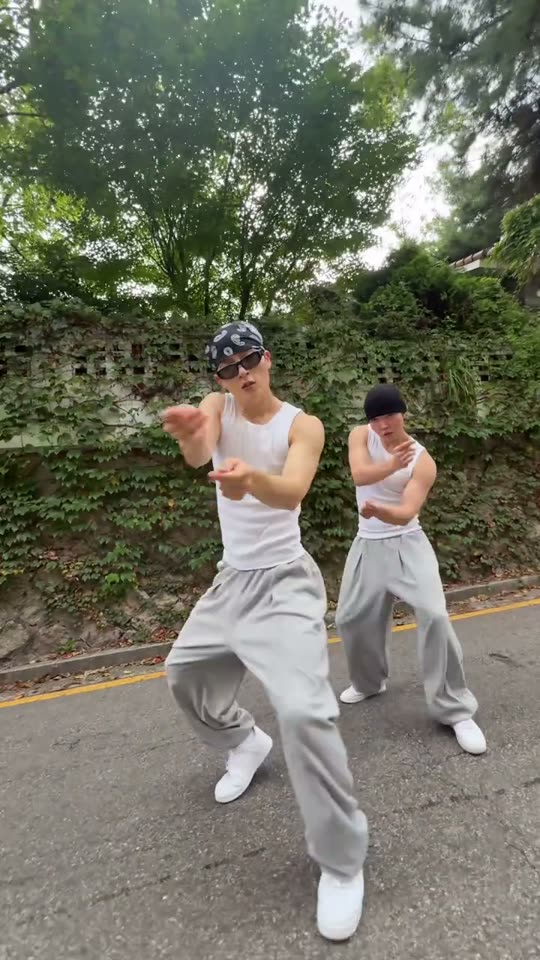 Two men dancing outdoors