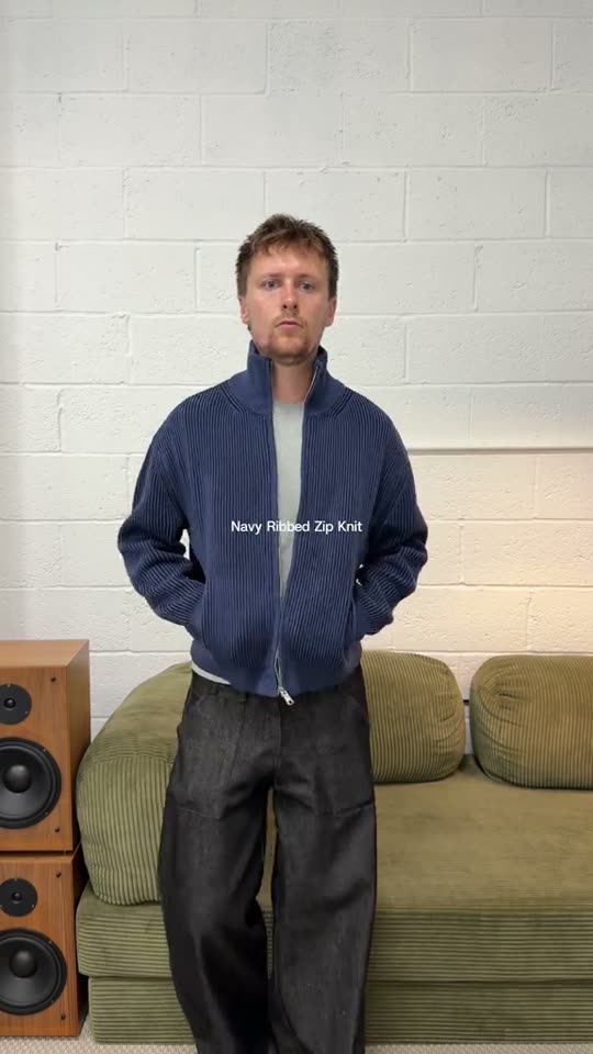 Man models navy zip knit