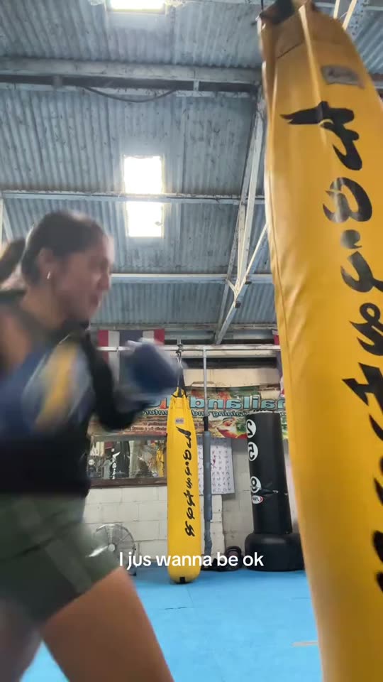 Woman boxing a punching bag