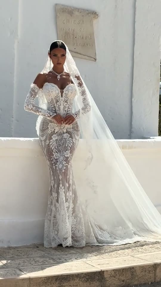 Woman poses in wedding dress