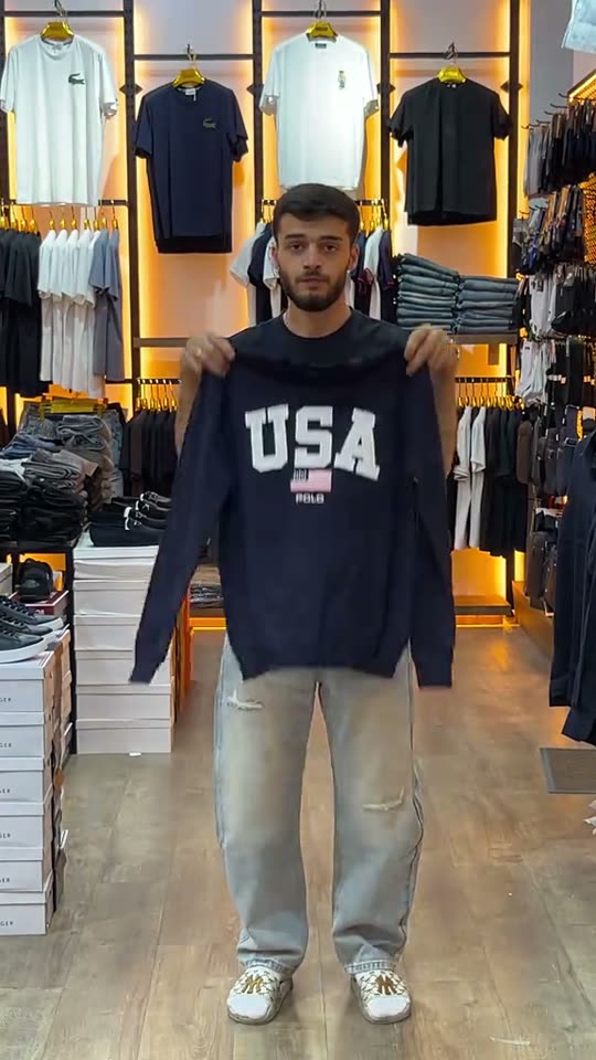 Man shows off USA sweatshirt