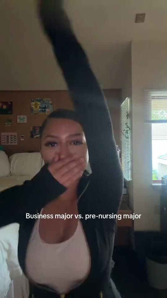 Girl covers mouth, raises arm