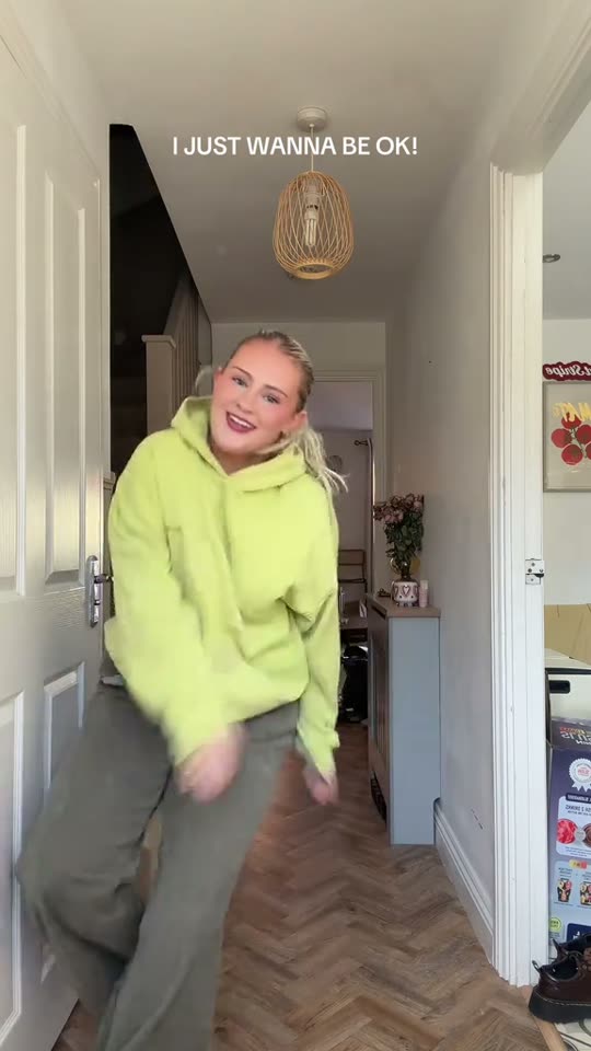 Woman dances in hallway