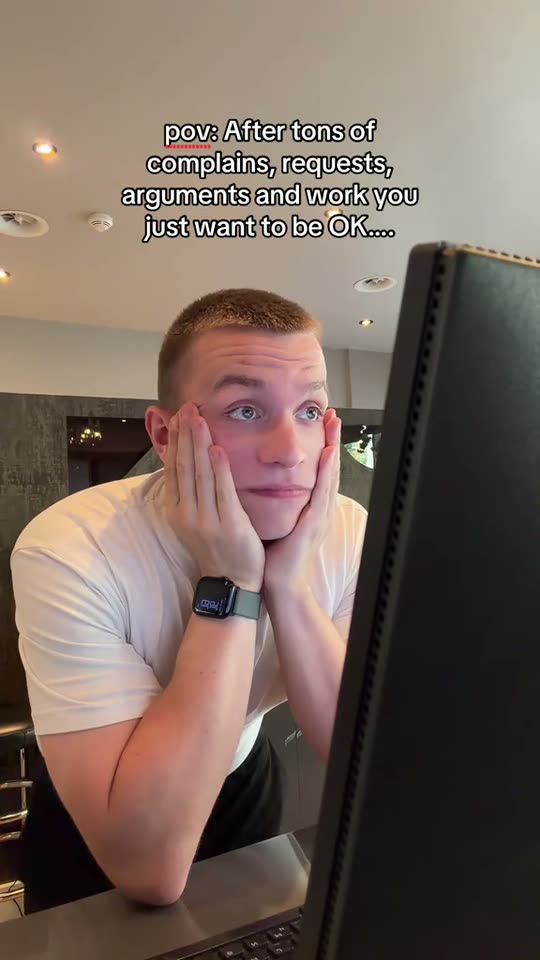 Man looking tired at computer