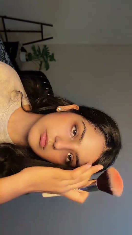 Applying makeup with a brush