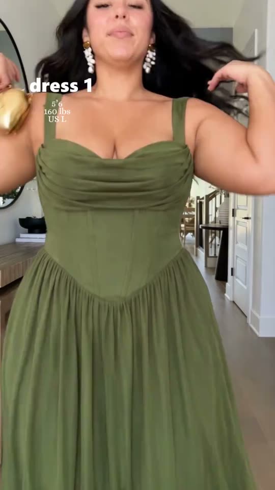 Trying on a green dress