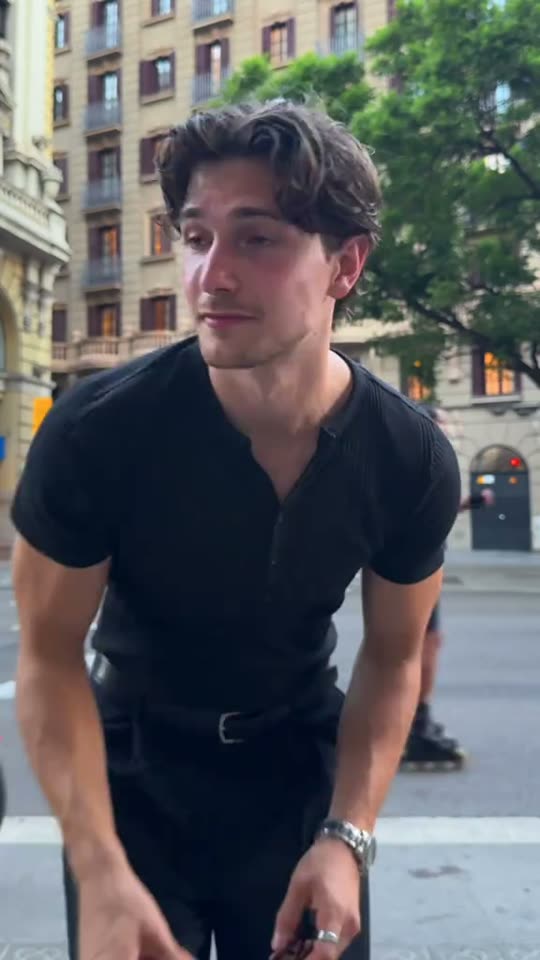Man shows off black outfit