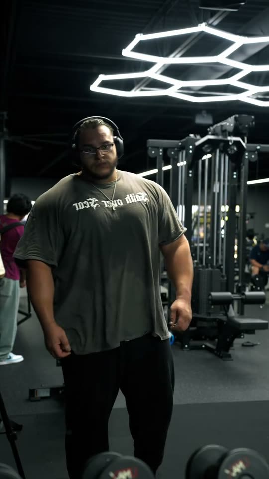 Man poses in gym