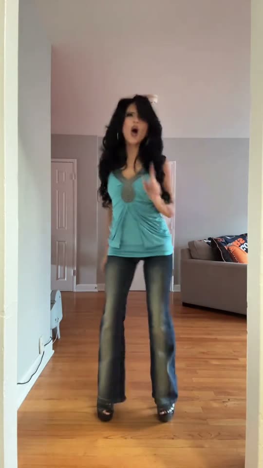Woman dancing in Y2K outfit