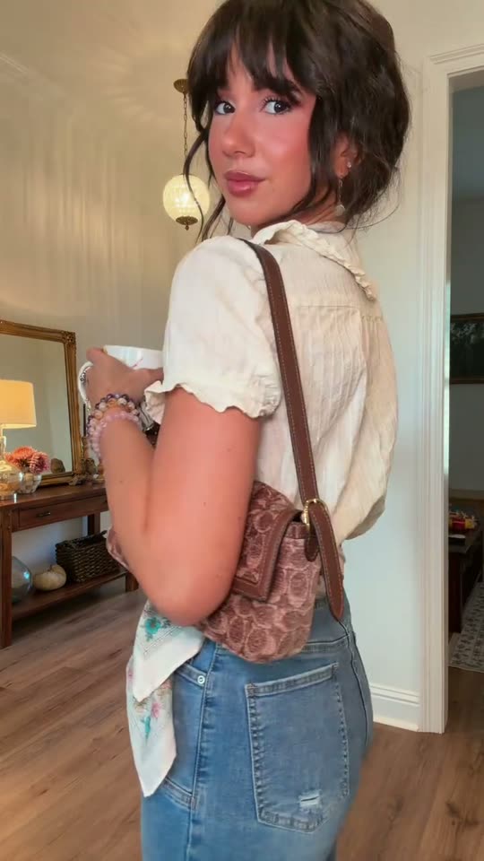 Woman shows off fall outfit