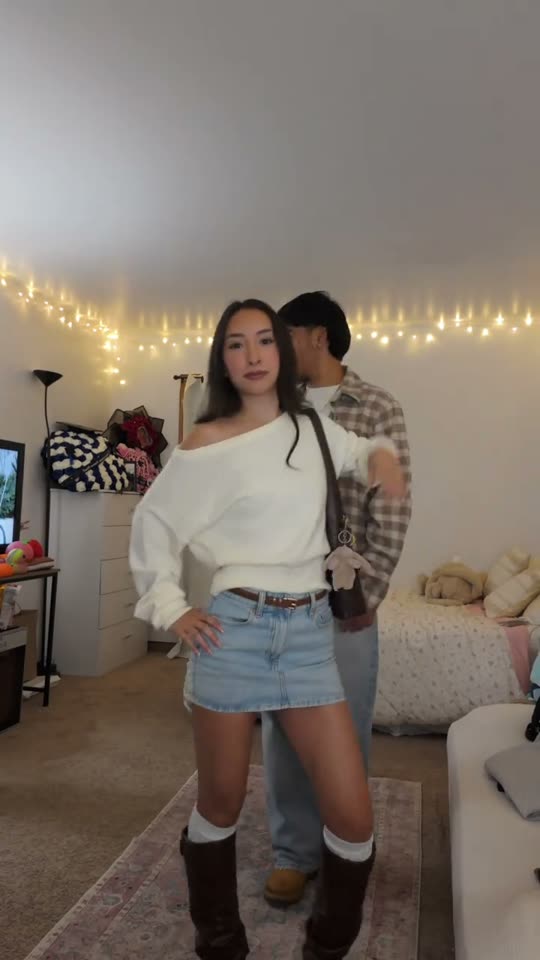 Couple poses in casual outfits