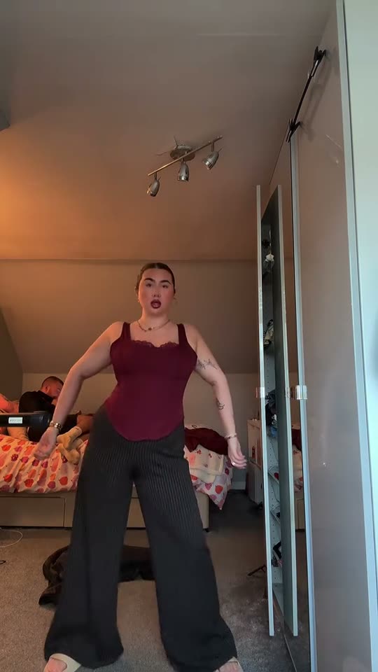 Woman dancing in bedroom