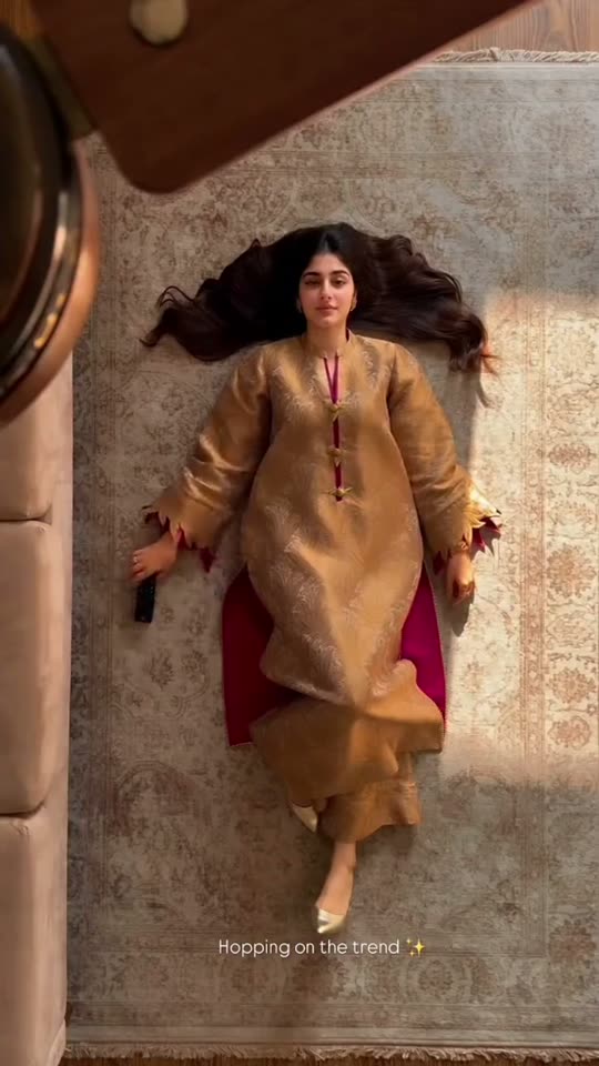 Fan transition into a gold dress