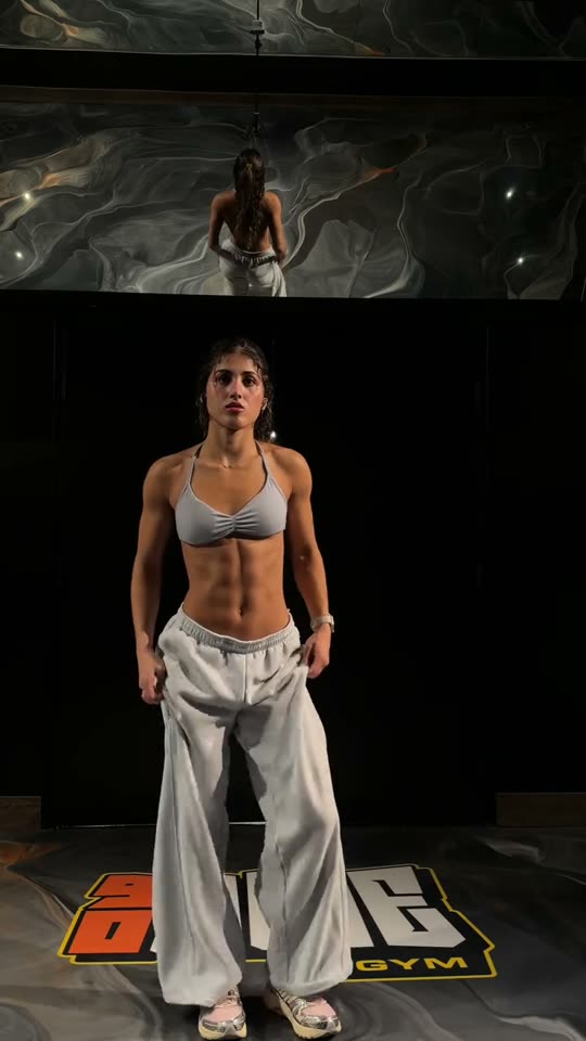 Woman shows off gym physique