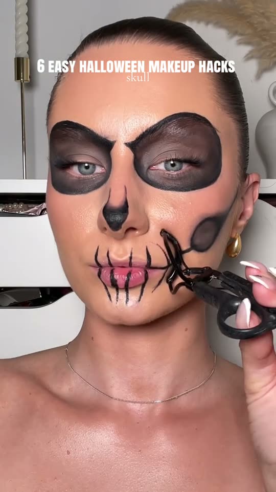Applying skull Halloween makeup