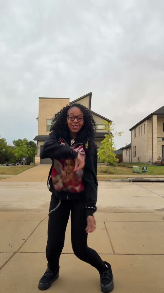 Dancing in front of houses