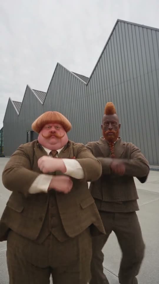 Two men dancing in suits