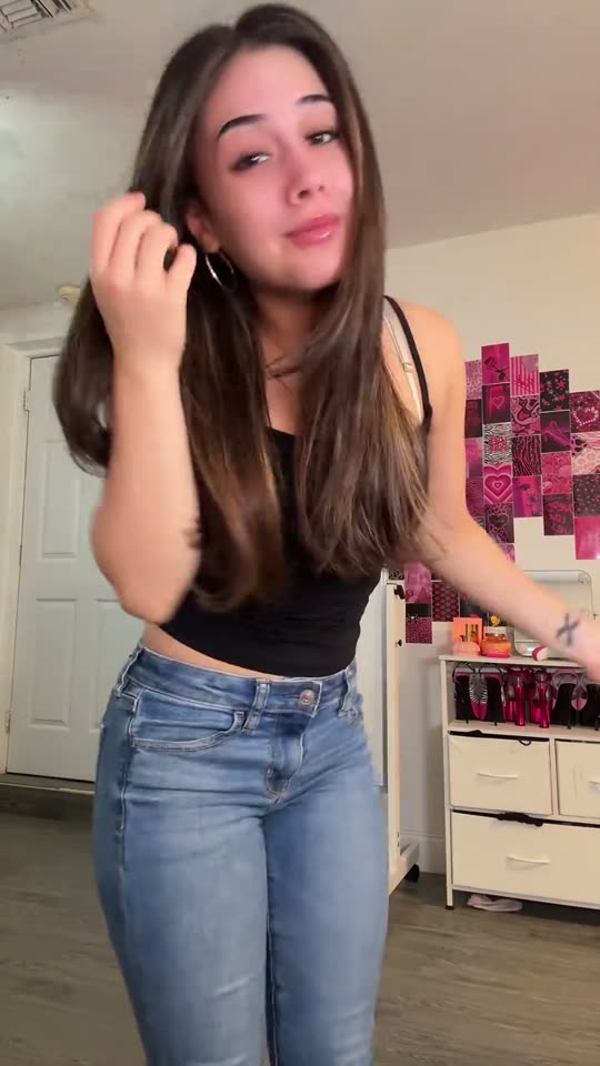 Woman dances in bedroom