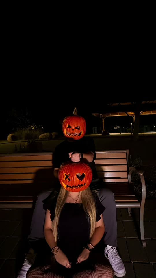 Couple with pumpkin heads